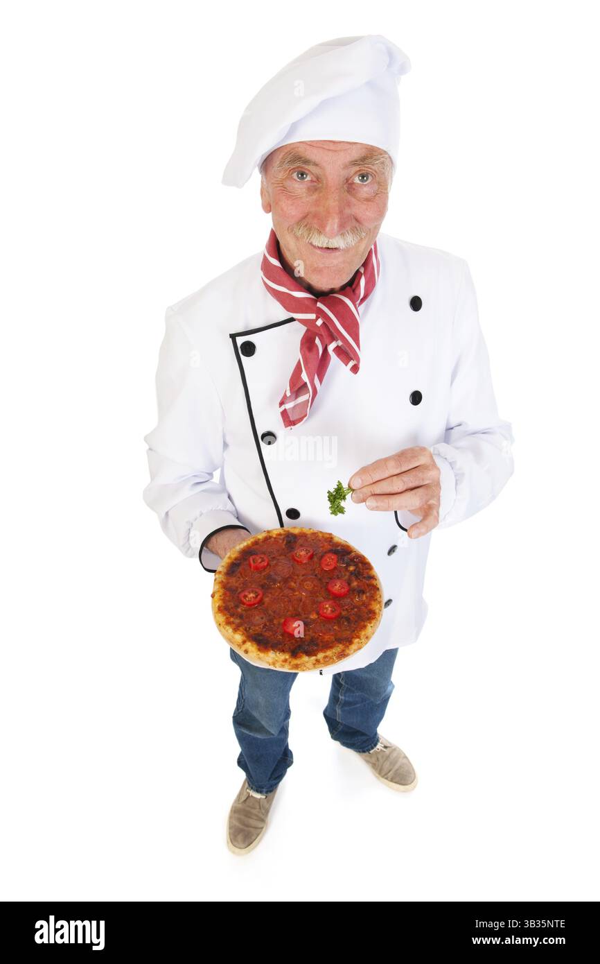 Cuoco Italiano tenendo la pizza per il tocco finale Foto Stock