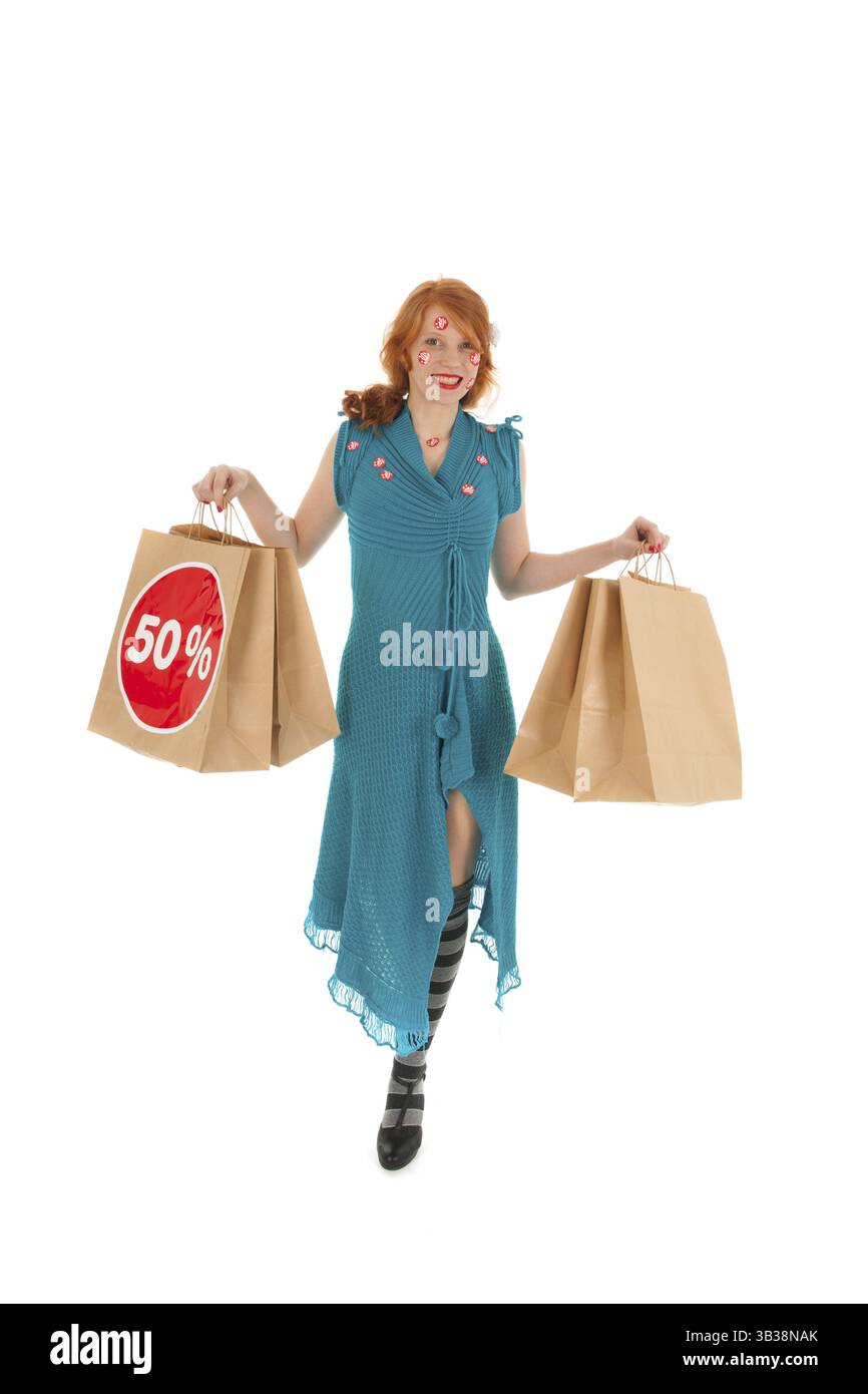 Donna durante la stagione vendita con borse Foto Stock