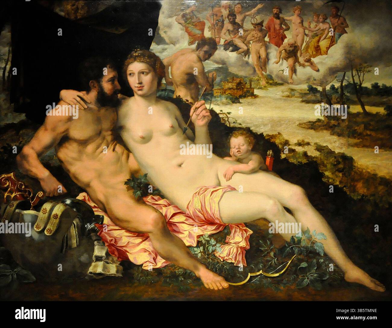 Nel mito greco Afrodite (Venere in romano) è sposata con Efesto (Vulcano in romano) in un matrimonio combinato da Zeus (Giove). Le fonti variano per quanto riguarda la ragione del matrimonio, ma al concorda sul fatto che Efesto/Vulcano ha una gamba zoppa e che Afrodite/Venere non lo ama. Ha una relazione con il dio della guerra Ares (Marte in romano). Ebbe anche una relazione con i mortali Anchise e Adone. In questo dipinto di Vincent Sellaer vediamo Afrodite e Ares insieme a Efesto che guardano con gelosia Foto Stock