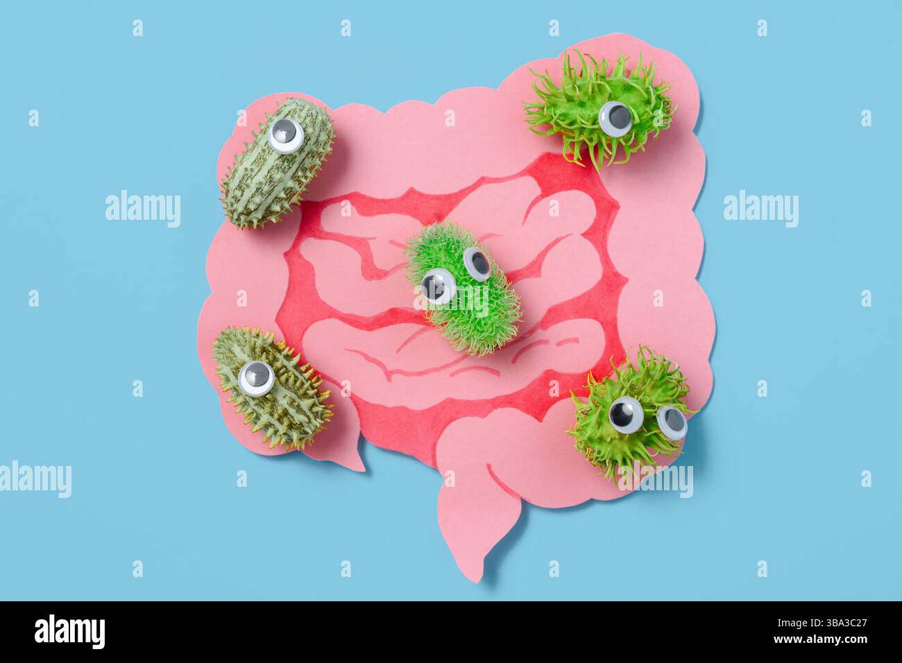 Batteri cartoon con occhi googly dentro ritaglio intestini sani sfondo blu, salute del sistema digestivo, concetto illustrativo medico Foto Stock