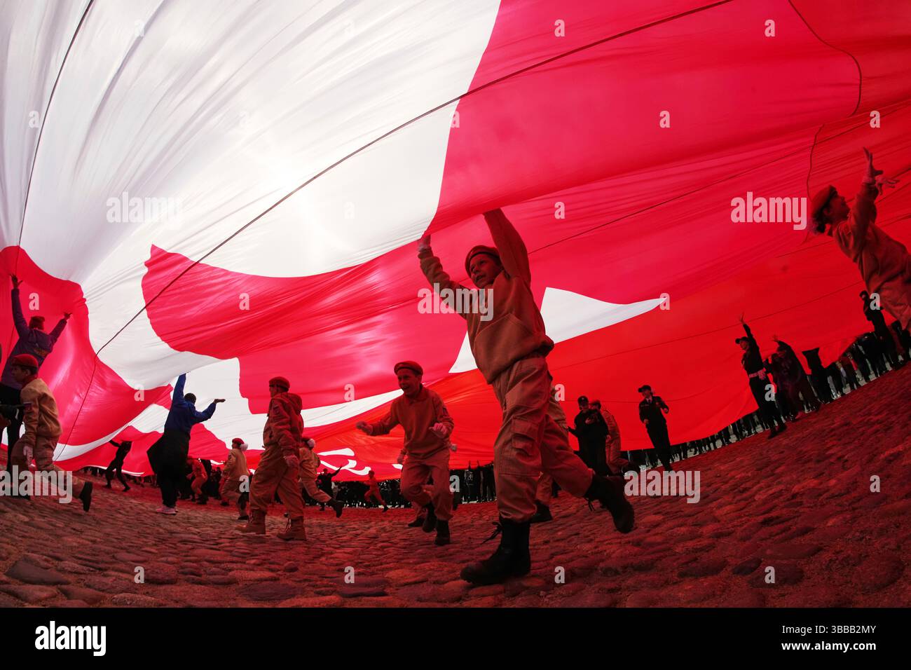 cadets-and-young-volunteers-unfurl-a-giant-replica-of-the-soviet-flag