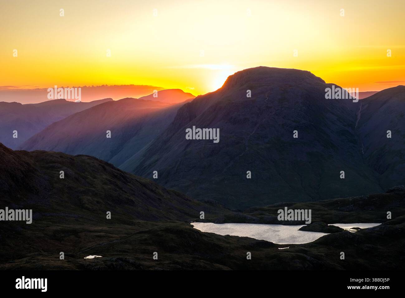 Tramonto sul Great Gable nel Lake District National Park, Cumbria, Regno Unito Foto Stock