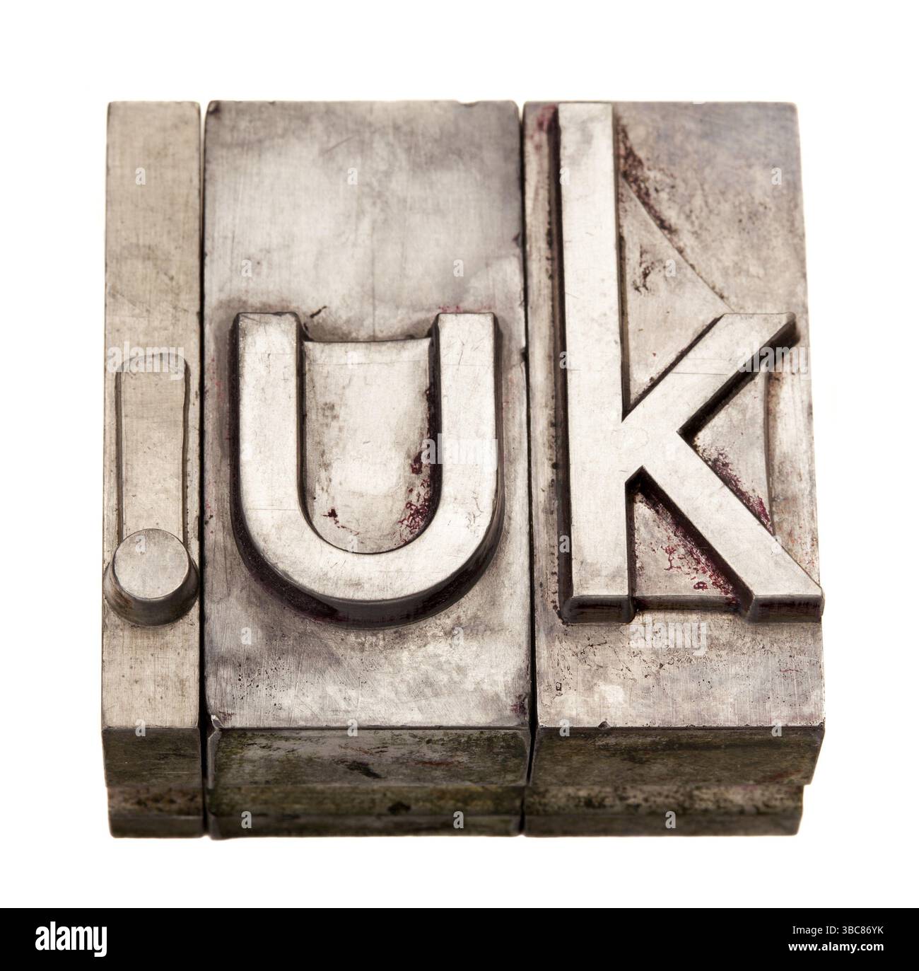 DOT UK - dominio nazionale su Internet per il Regno Unito, blocchi di stampa per tipografia in metallo grunge, macchiati da inchiostro, isolati su bianco Foto Stock