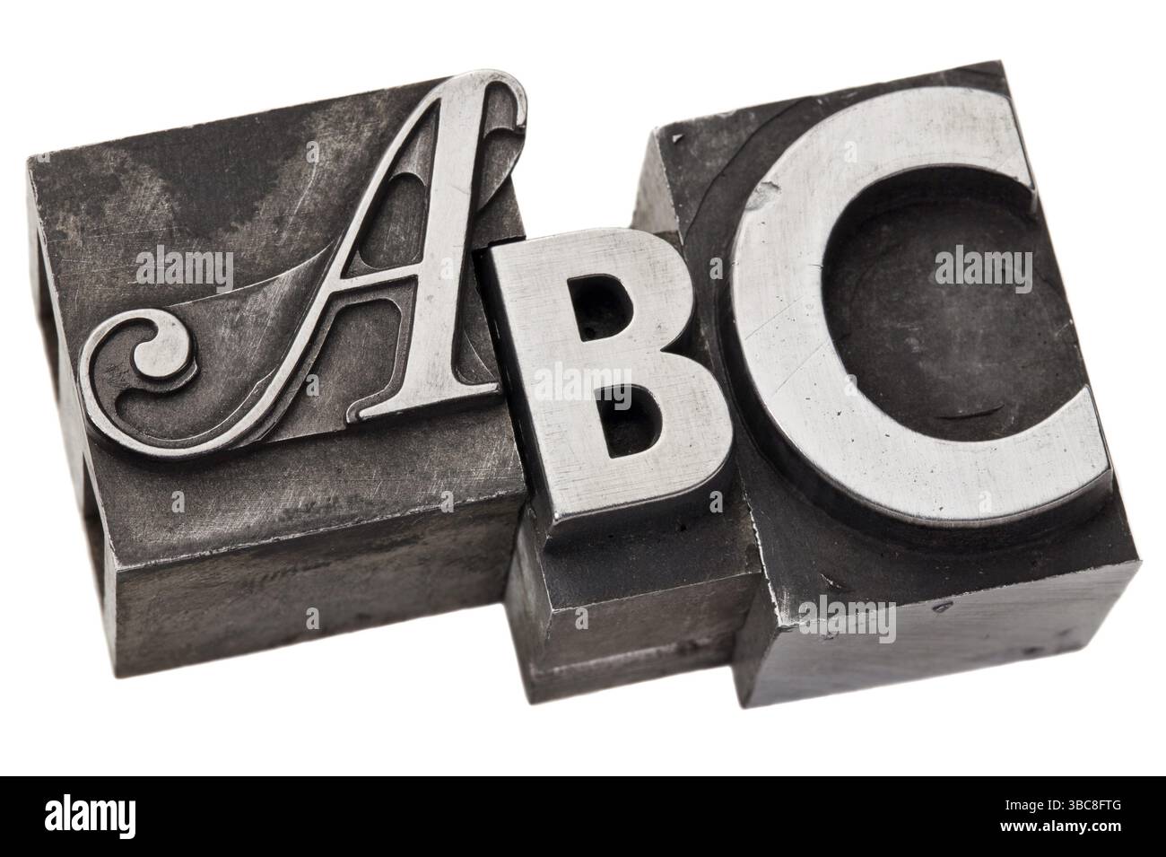 ABC - le prime tre lettere dell'alfabeto in stile vintage letterpress in metallo, isolate su bianco Foto Stock