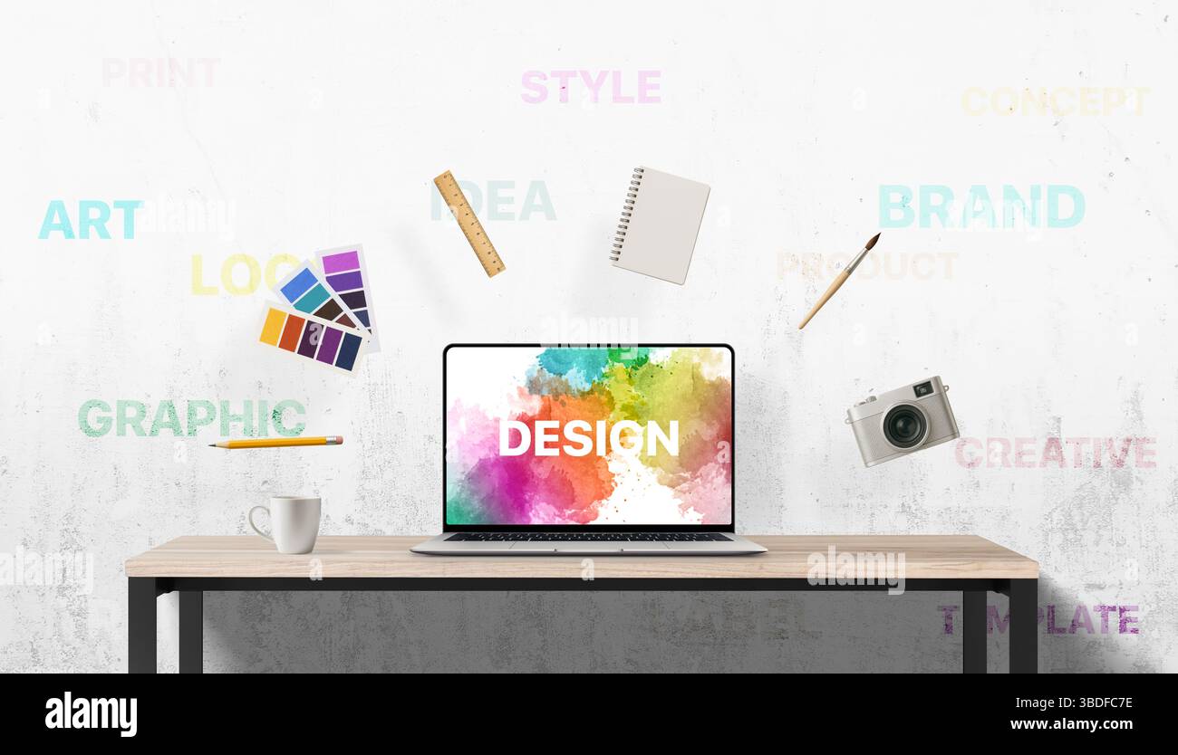 Vivace scena di design con materiali d'arte fluttuanti e parole chiave ispiratrici sulla parete dietro lo spazio di lavoro di un laptop, catturando il processo creativo in movimento Foto Stock