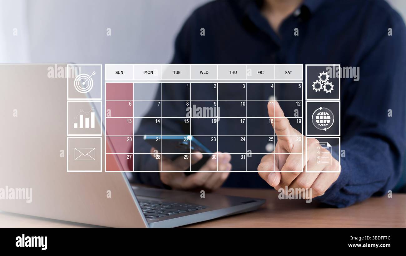 L'uomo d'affari usa il dito indice per impostare l'agenda sul calendario come concetto di pianificazione degli appuntamenti. Foto Stock