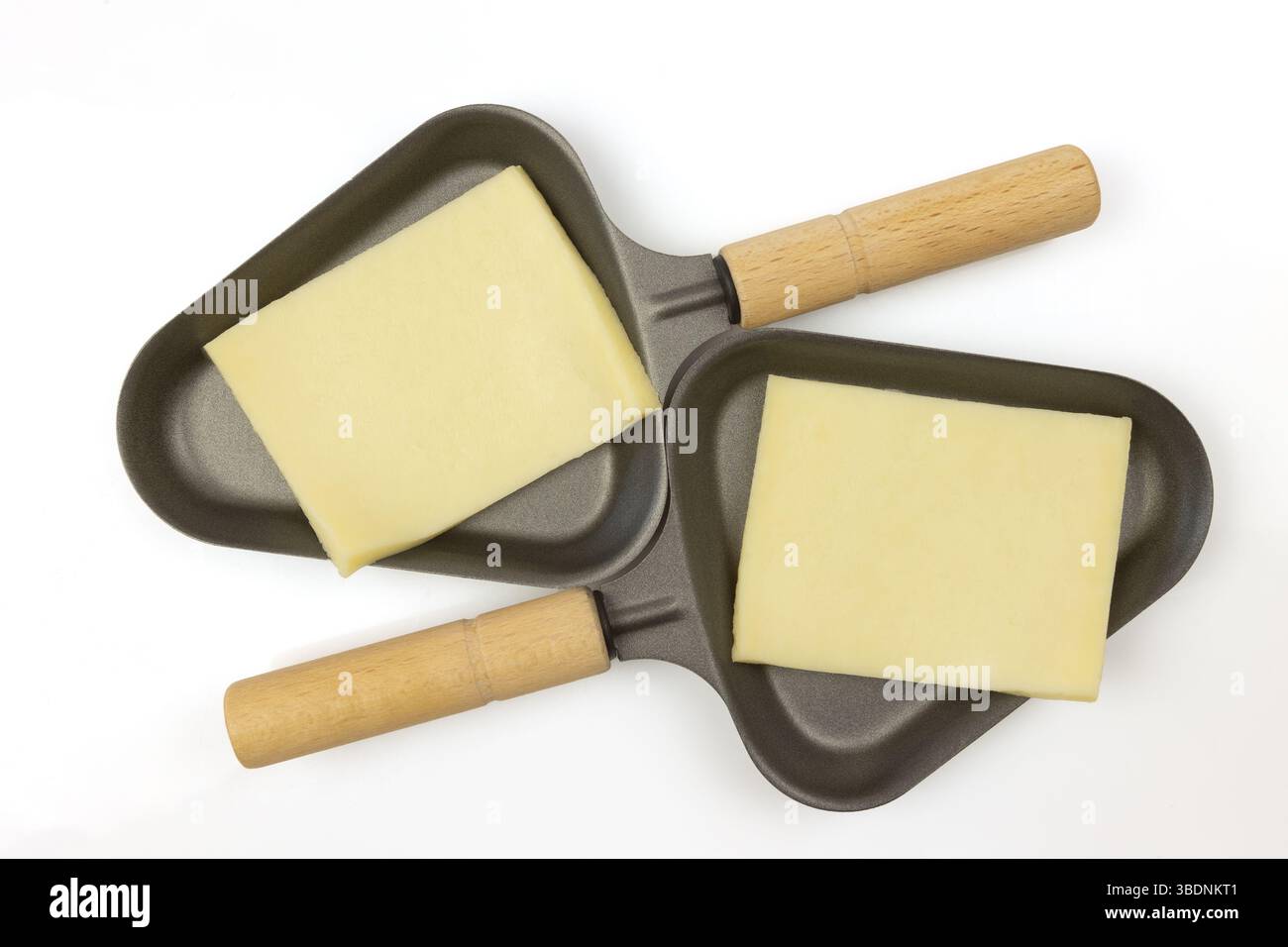 Formaggio di raclette in padelle tradizionali Foto Stock