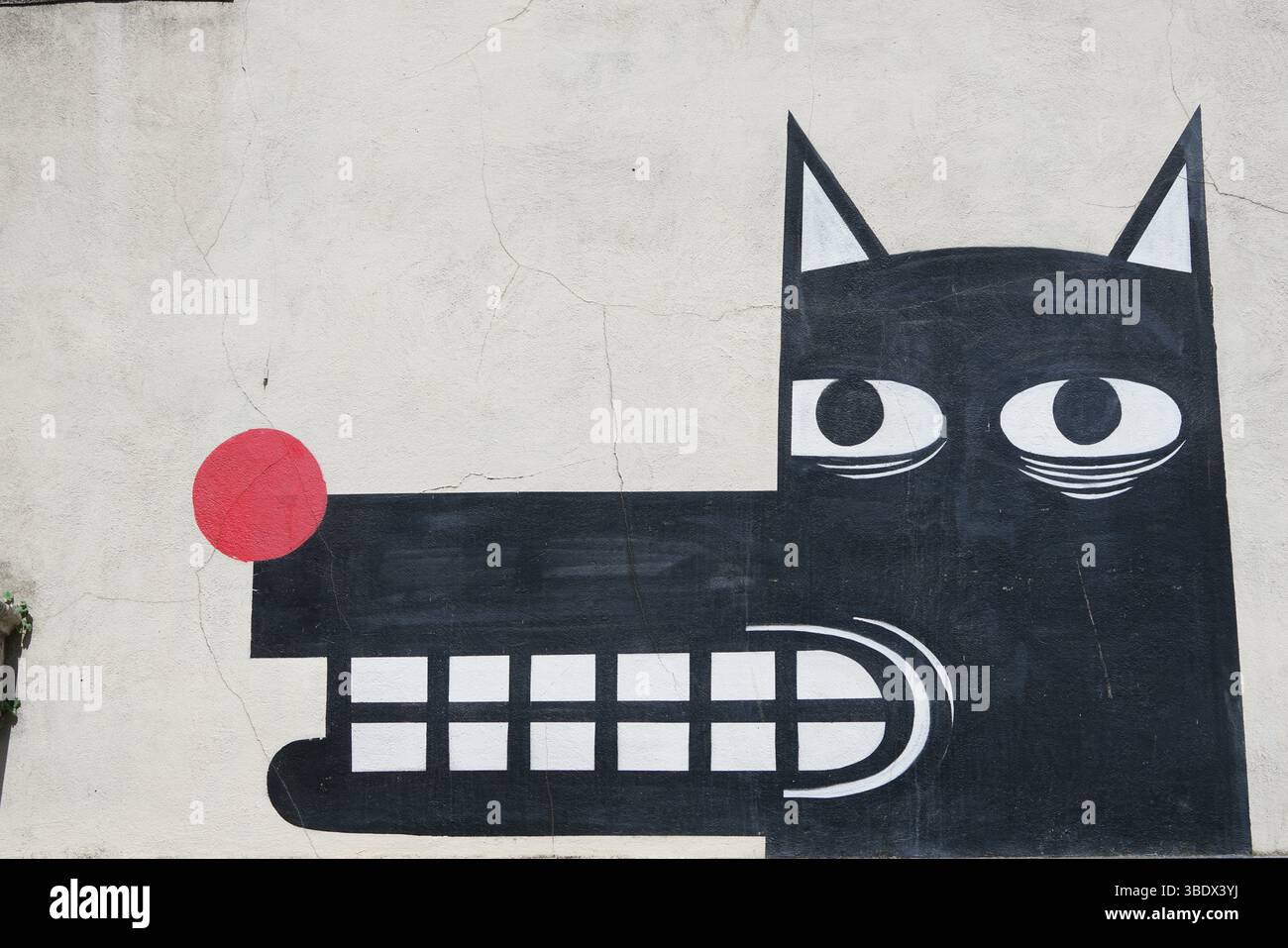 Astratto Street Art raffigurante un design minimalista Black Wolf su White Wall di JPS.Chichester, Regno Unito Foto Stock