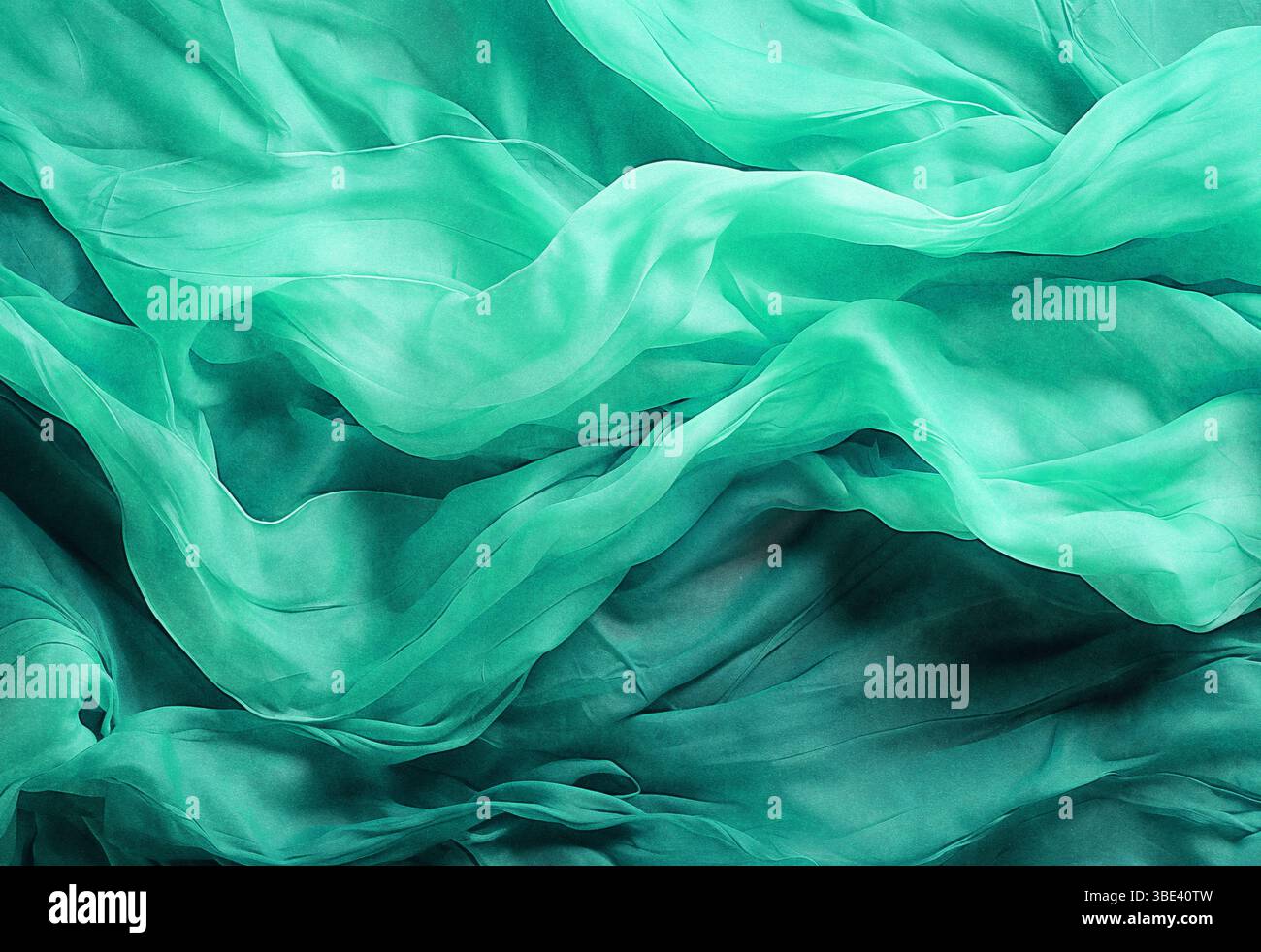 Chiffon, materiale traslucido. vista dall'alto. pieghe in tessuto leggero. Sfondo per matrimoni. Sfondo verde di lusso, il tessuto giace in onde morbide. Foto Stock