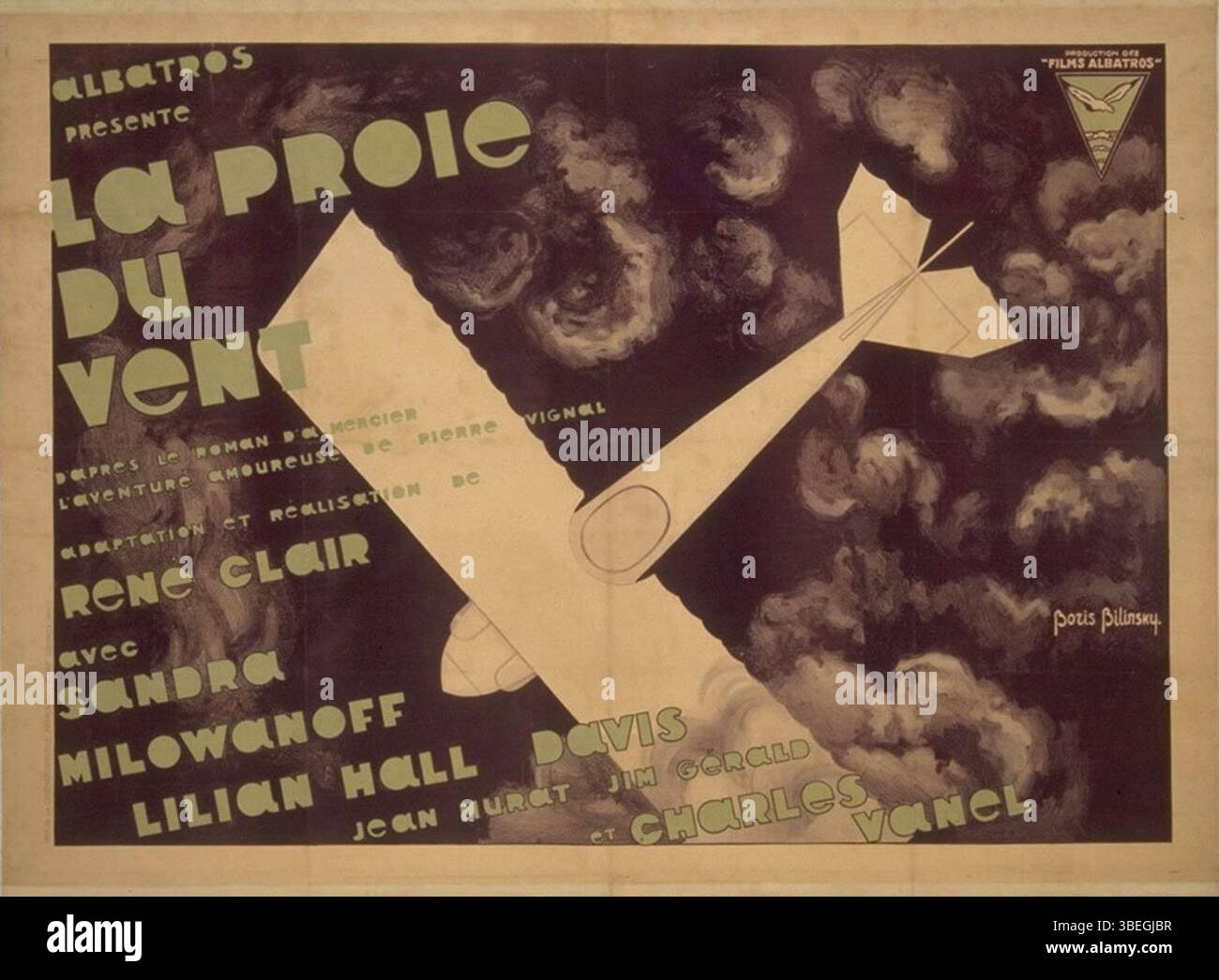 Il poster del 1927 di Boris Bilinsky per "la Proie du vent", un film di René Clair, mostra elementi visivi audaci tipici della pubblicità cinematografica francese degli anni '1920. Il design riflette i temi drammatici del film, un classico del cinema muto francese. Foto Stock