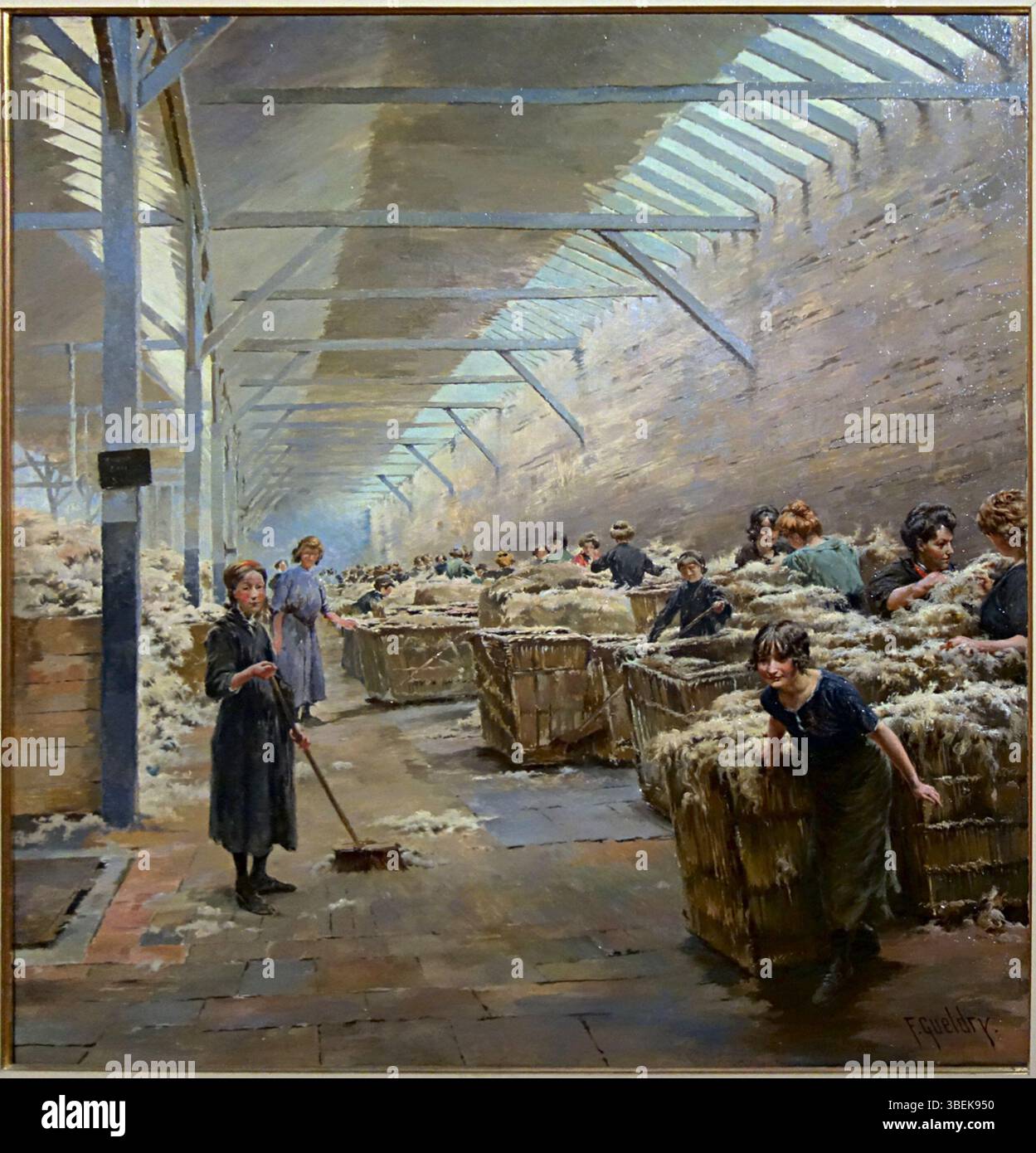 Questo dipinto del 1913 di Ferdinand Gueldry raffigura una scena di smistamento della lana a Roubaix. Il lavoro cattura i processi industriali dei primi anni del XX secolo, concentrandosi sul commercio della lana nella regione. Foto Stock