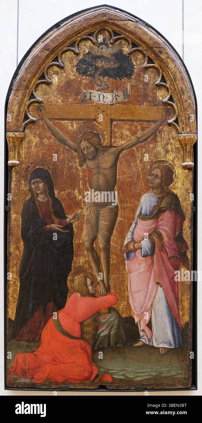 Questo dipinto del 1450 di Nicola di Ulisse da Siena raffigura la Crocifissione di Gesù Cristo, sottolineando la sofferenza e il sacrificio al centro della fede cristiana. È un esempio chiave dell'arte religiosa medievale italiana. Foto Stock