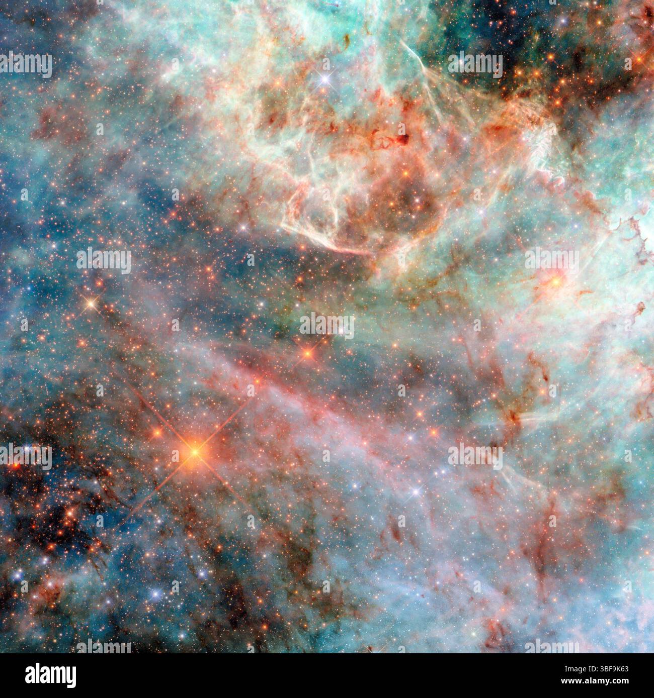 Questa immagine di Hubble mostra nuvole di gas colorate nella grande Nuvola di Magellano, una galassia nana a 160.000 anni luce di distanza. Catturata con la Wide Field camera 3 di Hubble utilizzando filtri ultravioletti e infrarossi, rivela nuvole brillanti come il filo di candela cosmico. I colori rappresentano lunghezze d'onda diverse, esponendo elementi invisibili all'occhio. Un'immagine ottimizzata di Hubble mostra anche NGC 3507, una galassia a spirale barrata in Leo con bracci luminosi, corsie di polvere e galassie di sfondo distanti. Crediti: ESA/Hubble & NASA, D. Thilke Foto Stock