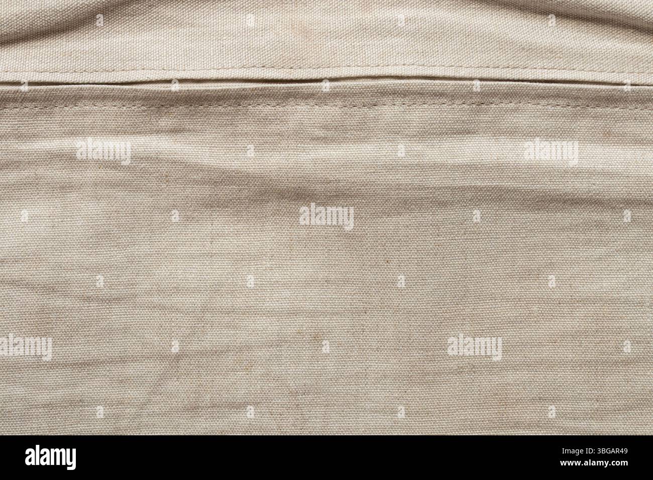 Trama in lino beige naturale primo piano e zip orizzontale, sfondo per design e creatività Foto Stock
