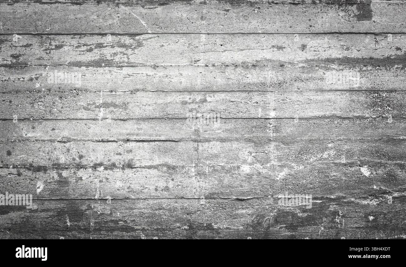 Parete in calcestruzzo grigio grezzo ideale per lo sfondo. Calcestruzzo esposto Foto Stock