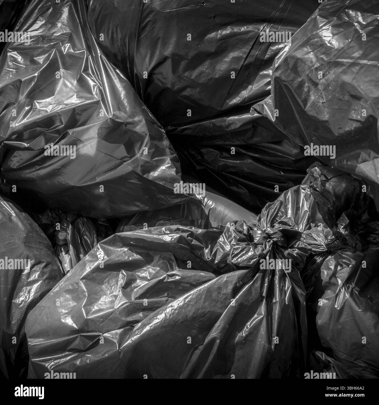 Testurizzato di plastica nera garbage bag per lo sfondo Foto Stock