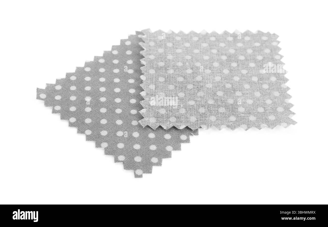 Campioni di tessuti con motivo a pois isolati su bianco Foto Stock