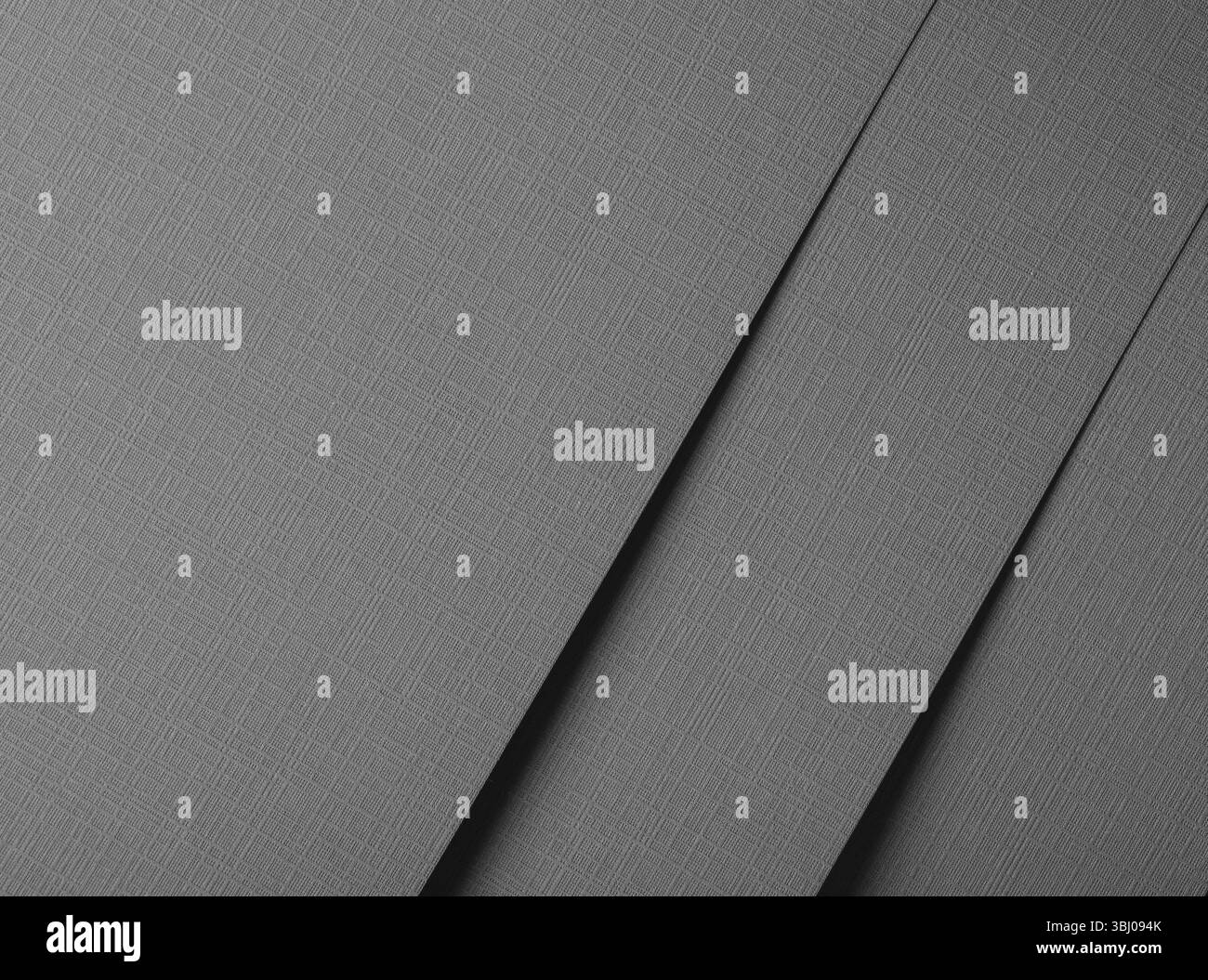 Carta opaca grigia con motivo in rilievo, con linee geometriche e una finitura sottile e strutturata. Design moderno e di alta qualità, perfetto per Foto Stock