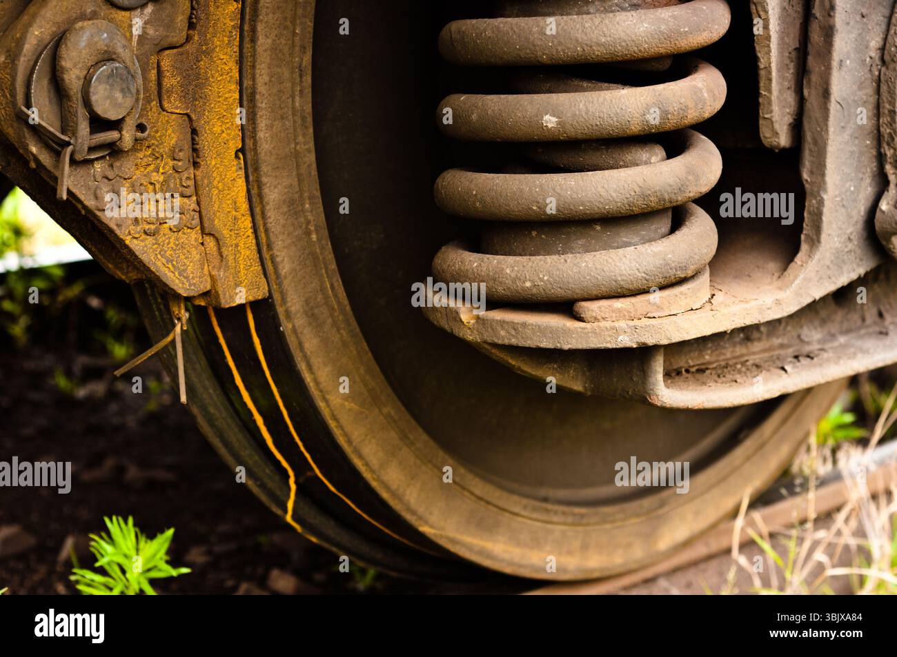 Vecchie ruote arrugginite di un treno Foto Stock