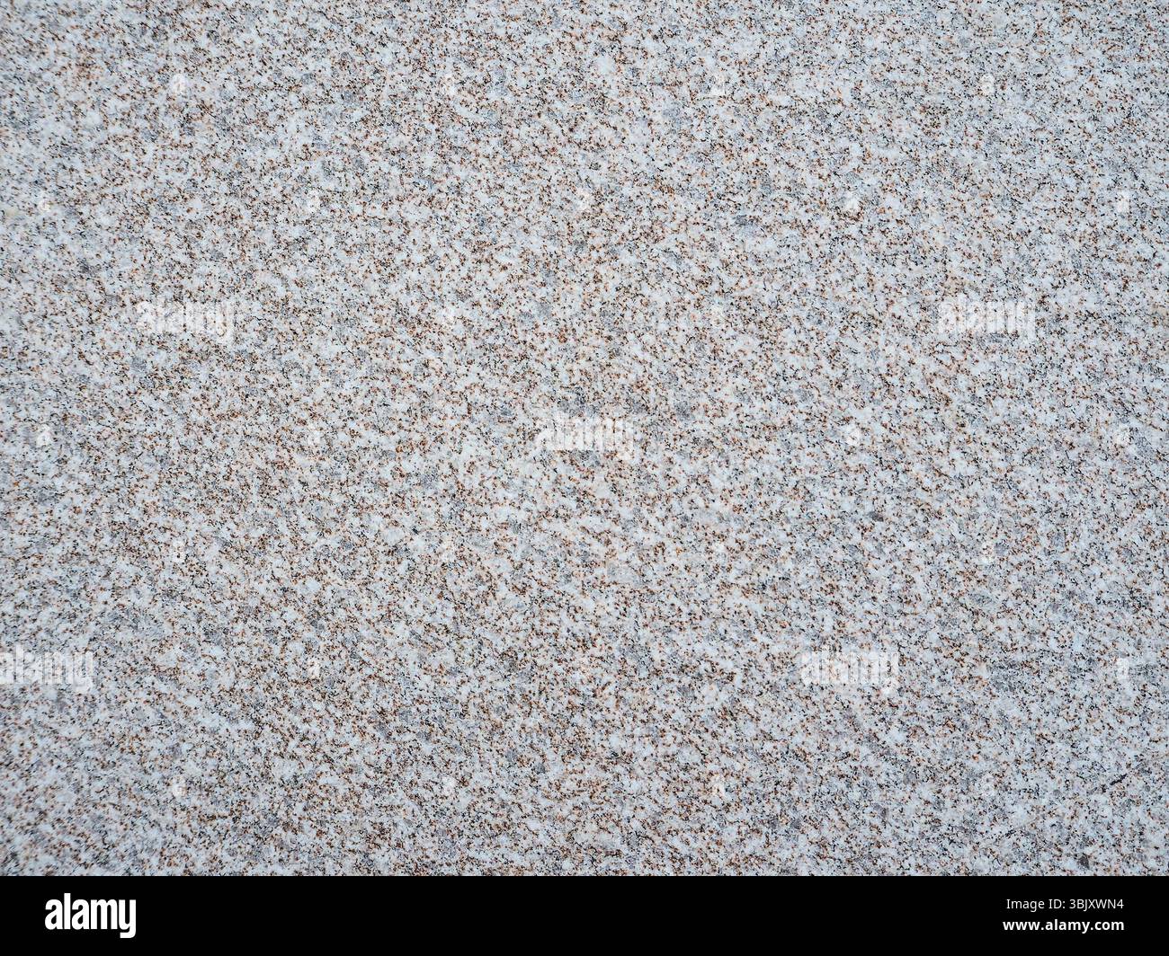 La consistenza della pietra artificiale grigia intervallata da schegge di granito. Foto Stock