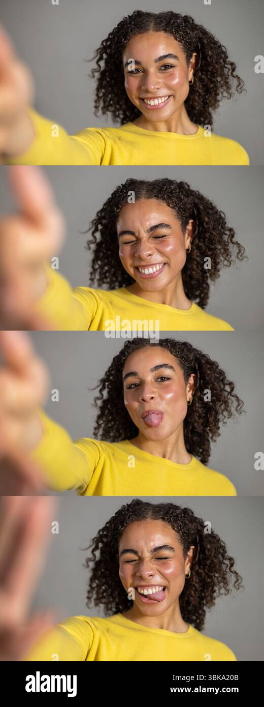Immagine composita in stile pellicola di una giovane donna adulta che fa i volti verso la fotocamera, fingendo di scattare selfie. Lei ha i capelli ricci scuri e io Foto Stock