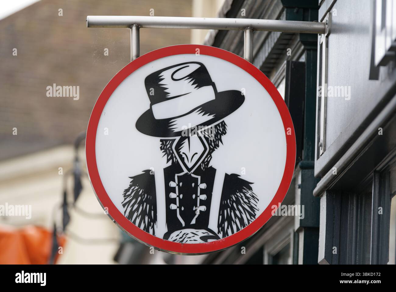 Cartello raffigurante un personaggio in stile vintage con caratteristiche di uccello e un cappello. Greenwich, Londra, Inghilterra Foto Stock