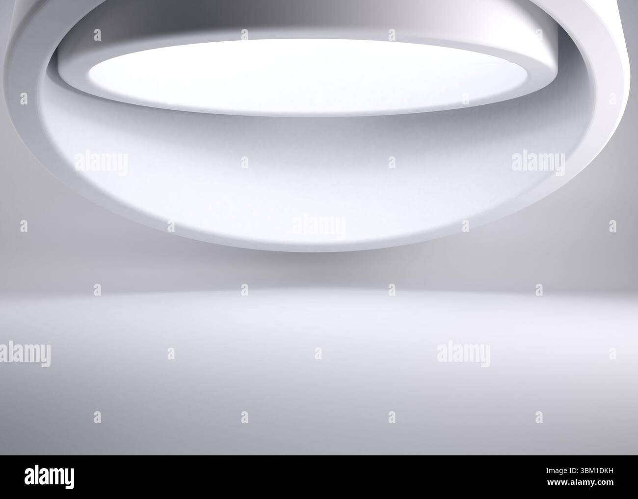 La moderna lampada circolare a LED si illumina in uno spazio minimalista e piatto Foto Stock La moderna lampada circolare a LED si illumina in uno spazio minimalista e piatto Foto Stock