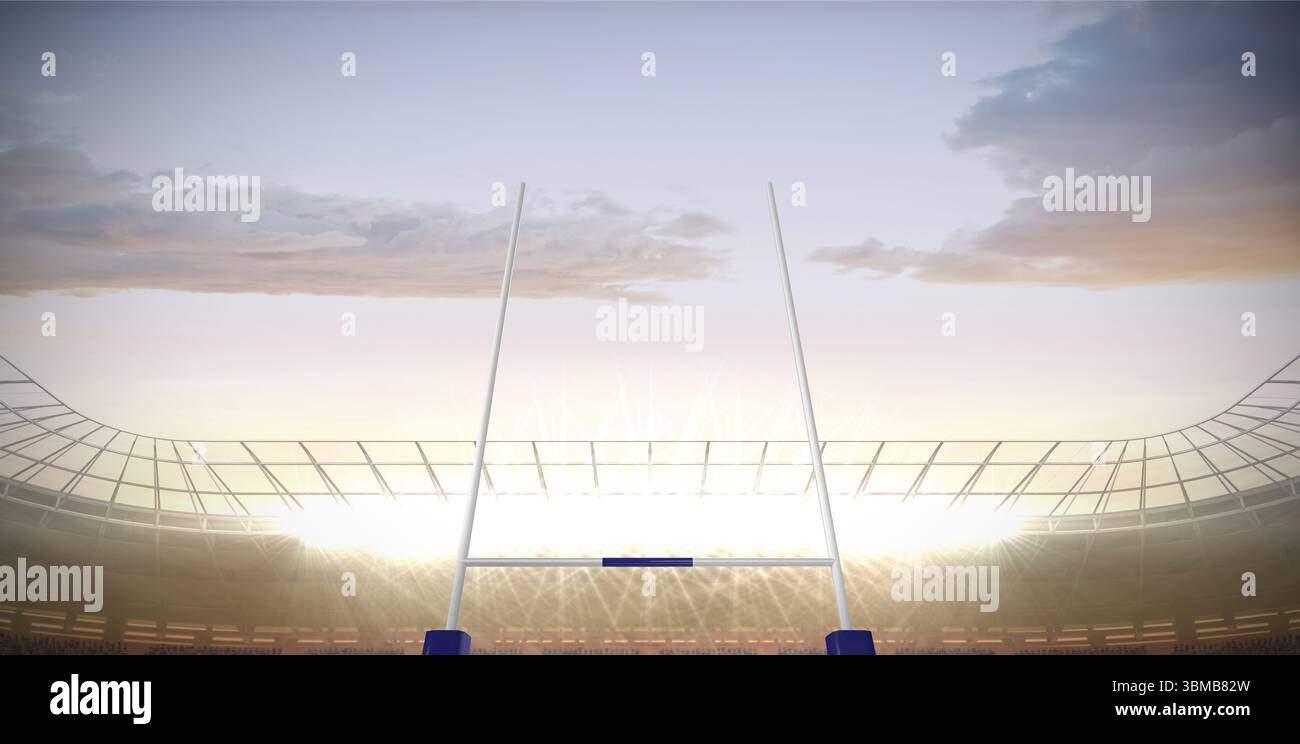 Design piatto che mostra alti pali di porta sul campo erboso dello stadio sotto i riflettori nuvolosi al crepuscolo Foto Stock