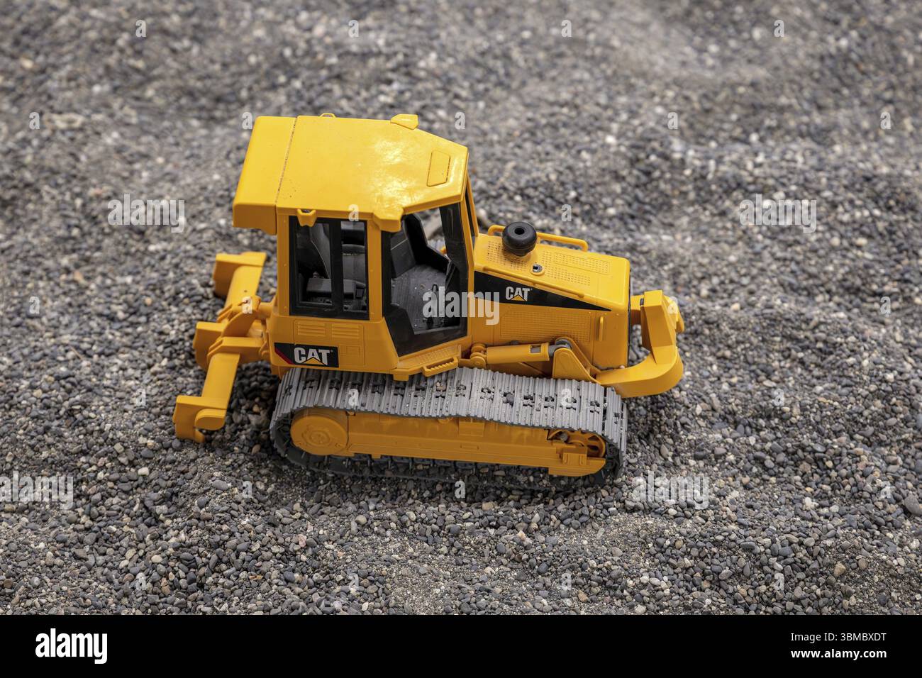 Trattore caterpillar caterpillar giocattolo per bambini Foto Stock