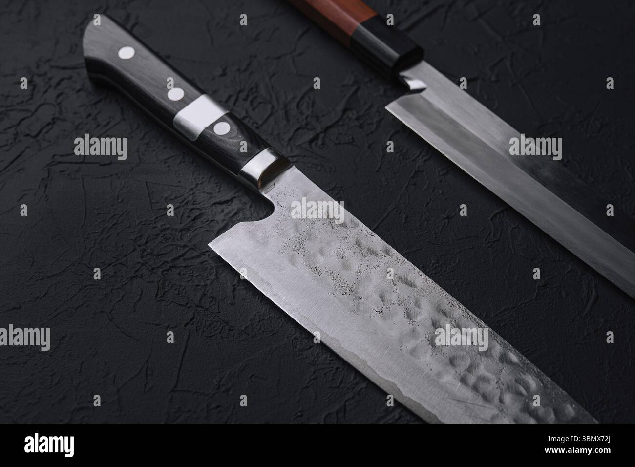 Food STILL-Life, accessori da cucina asiatica su tavolo in pietra nera Foto Stock