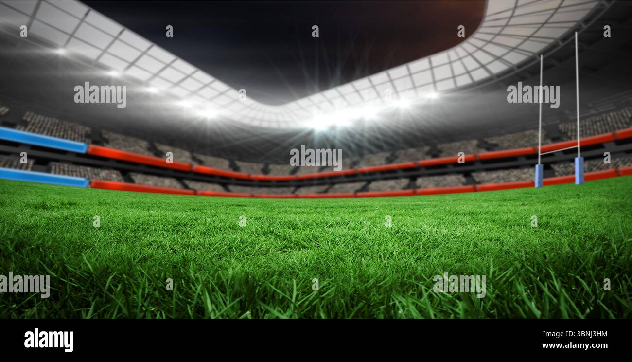 Stadio sportivo con campo di erba con pali, posti a sedere a più livelli, tetto curvo e proiettori Foto Stock
