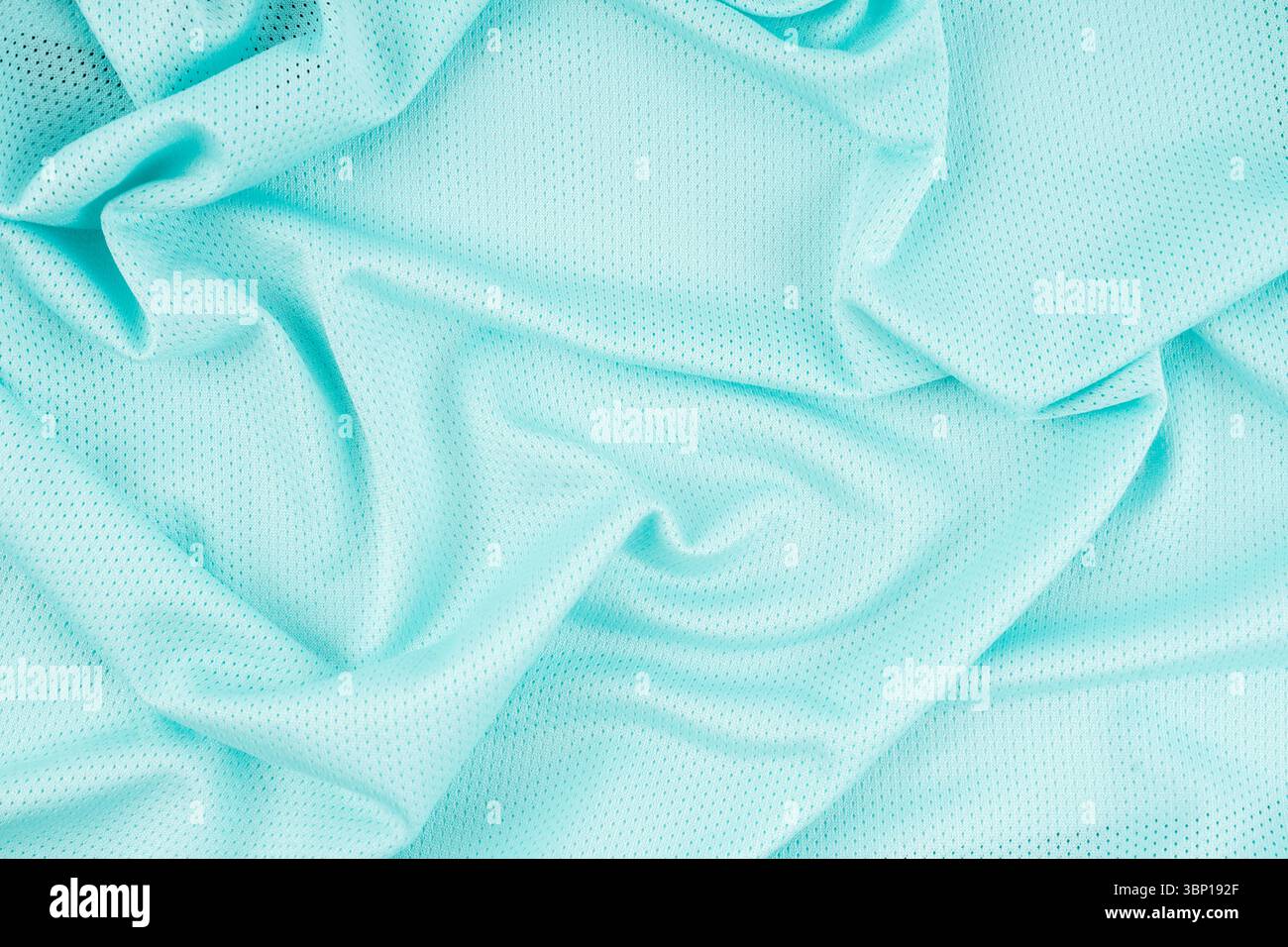 Maglia da calcio in tessuto sportivo turchese texture maglia sfondo astratto. Foto Stock