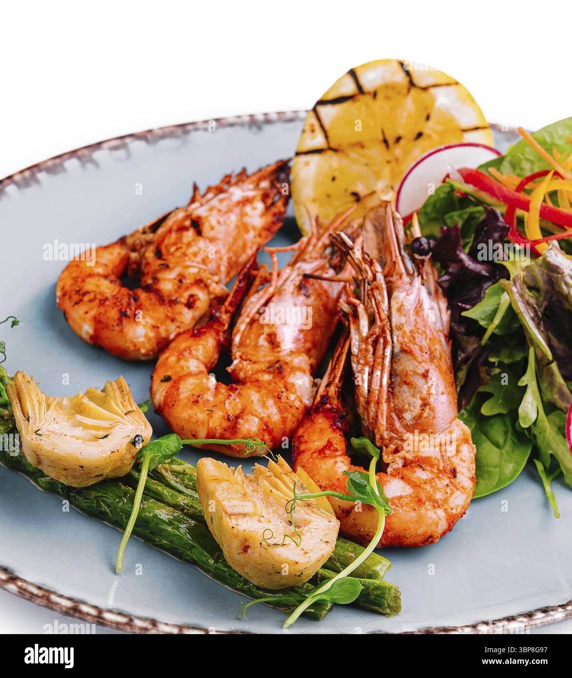 Cibo, gamberi fritti con asparagi e carciofi Foto Stock