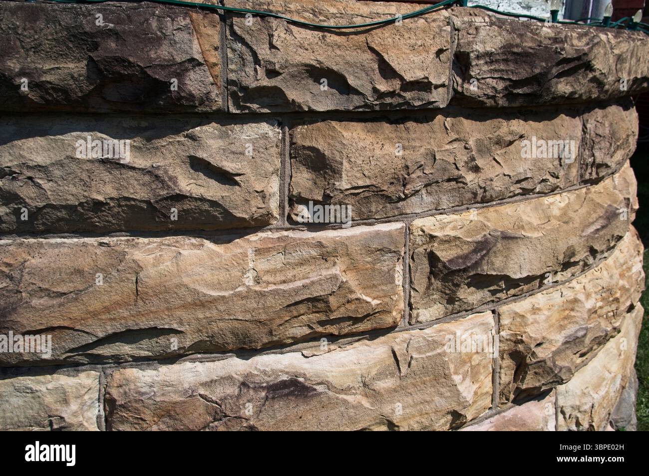 Parete esterna curva in arenaria Foto Stock