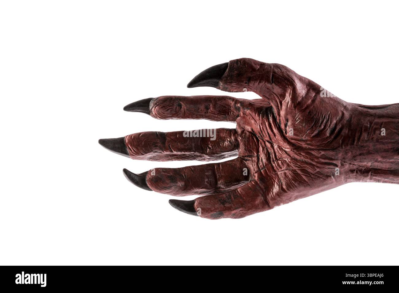 Mano del mostro del diavolo rosso isolata su sfondo bianco con percorso di ritaglio Foto Stock