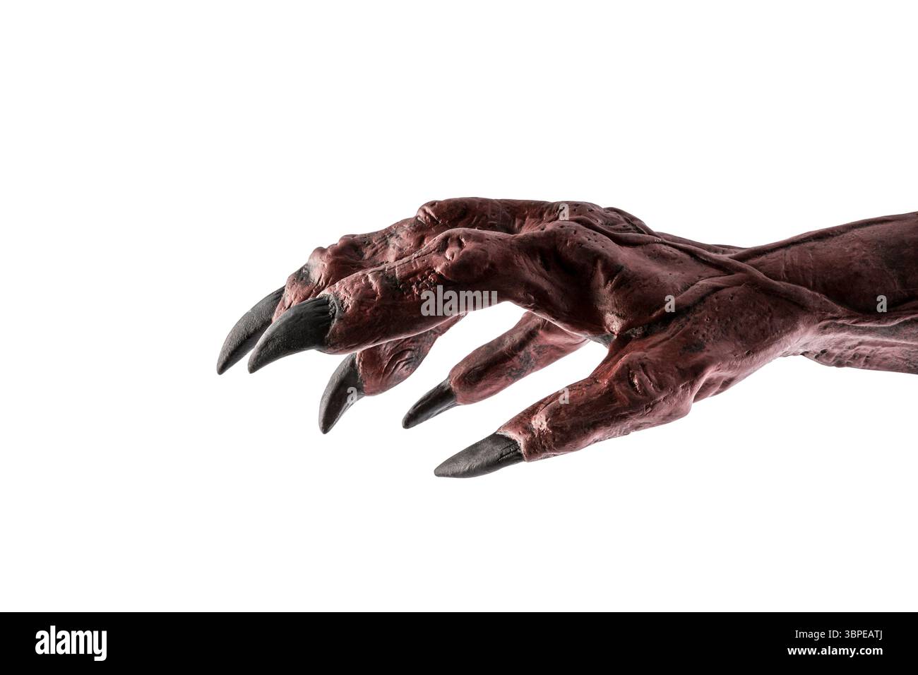 Mano del mostro del diavolo rosso isolata su sfondo bianco con percorso di ritaglio Foto Stock