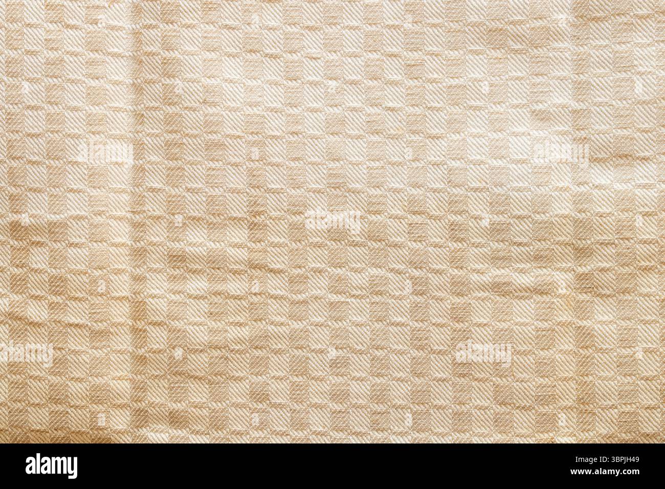 Sfondo in tessuto beige con motivo geometrico a scacchi, texture tessile per interni o design Foto Stock