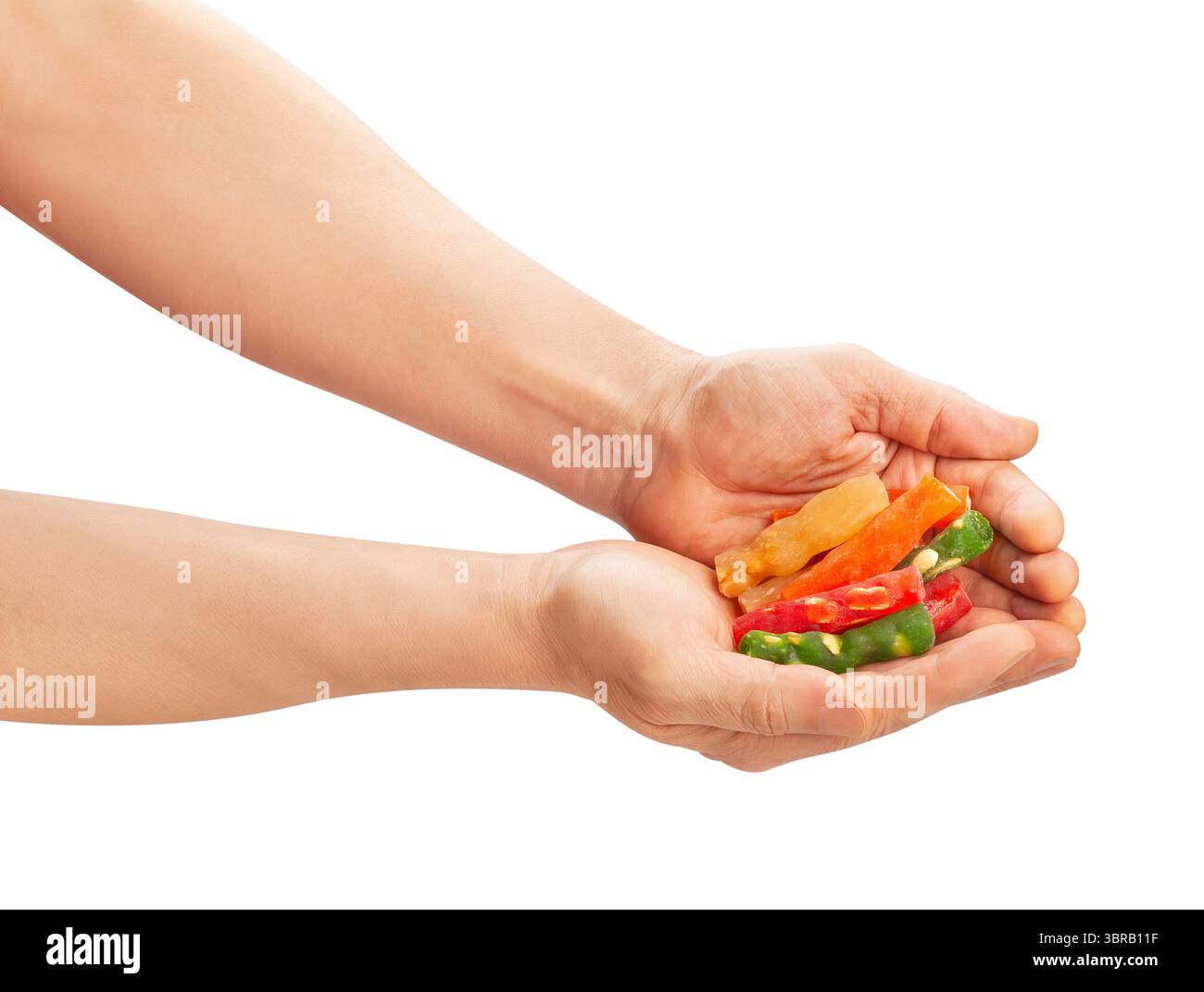 la gelatina amara le noci nel percorso della mano isolata sul bianco Foto Stock