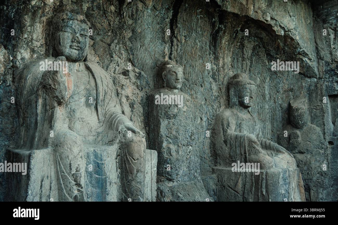 Viaggi in Asia, cultura cinese e sito patrimonio dell'umanità dell'UNESCO, le Grotte di Longmen, sculture buddiste cinesi in pietra nella provincia di Henan Foto Stock