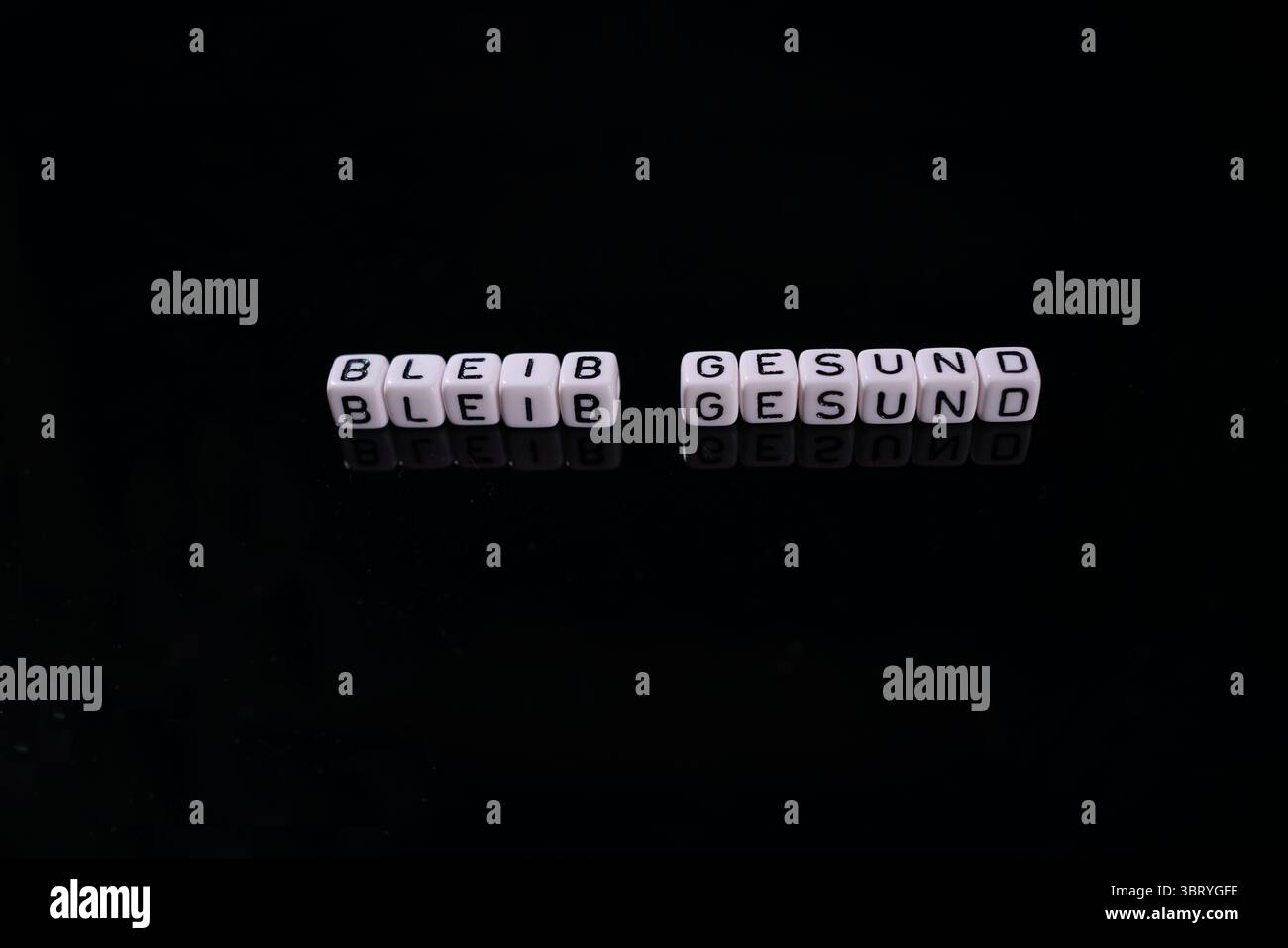 Resta in salute, rappresentato con i dadi Foto Stock