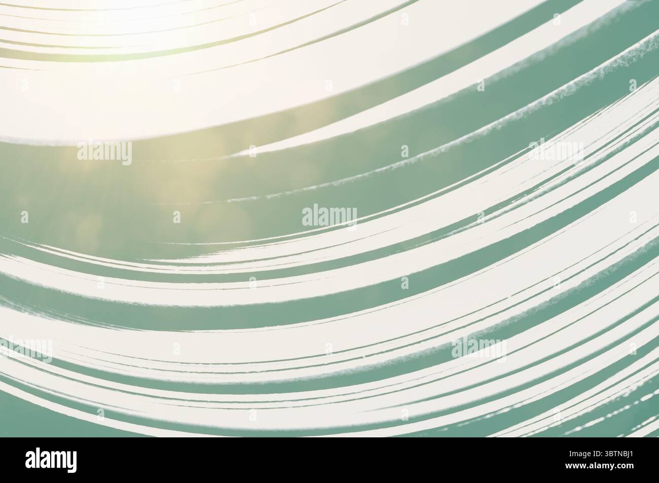risorsa grafica verde pallido e bianco, linee fluide e colorate curve con bagliore solare da una finestra Foto Stock