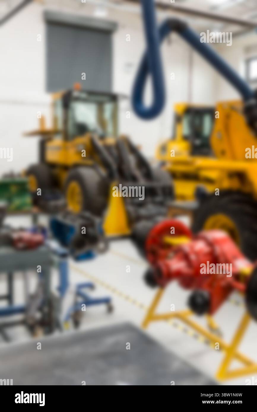 Due macchine gialle parcheggiano in un'officina di progettazione vettoriale con componente rosso, tubi flessibili blu, tubazioni di sicurezza Foto Stock