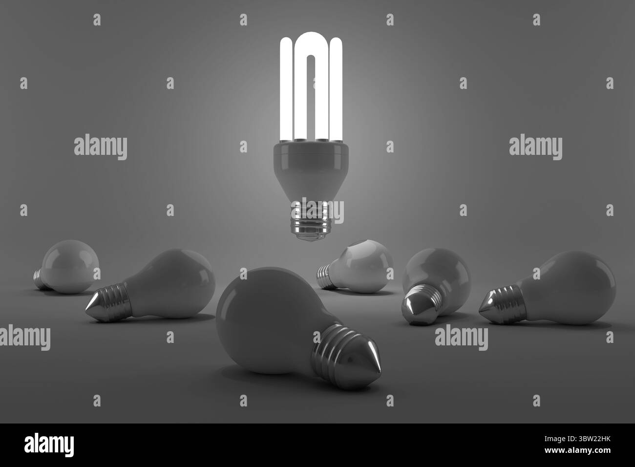 Immagine grafica di una lampadina a risparmio energetico illuminata sopra le lampadine Foto Stock