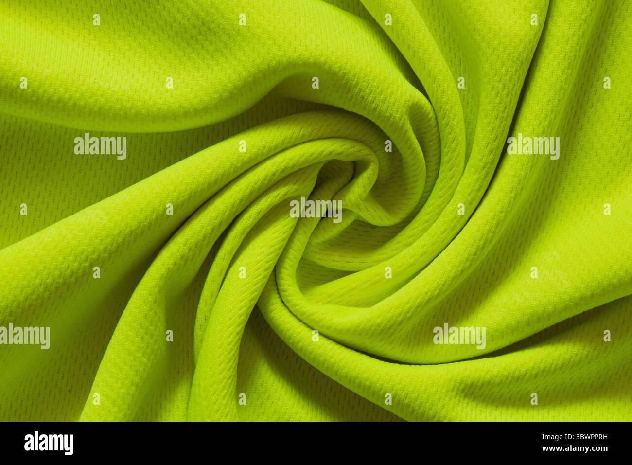 Tessuto sportivo al limone intrecciato al centro come sfondo per design, primo piano di pieghe, motivo tessile Foto Stock