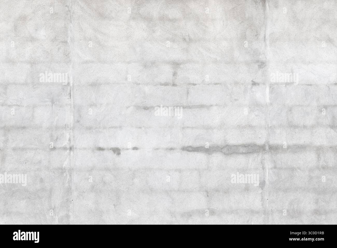 Una parete in cemento grigio liscio che presenta texture delicate, ombreggiature naturali e linee di cucitura sbiadite. Foto Stock