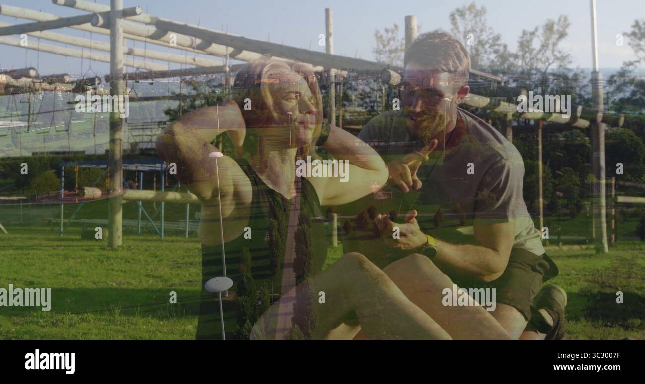 Si esibisce come atleta in abbigliamento sportivo al parco, con guida in pullman, tappetino per esercizi e smartwatch Foto Stock