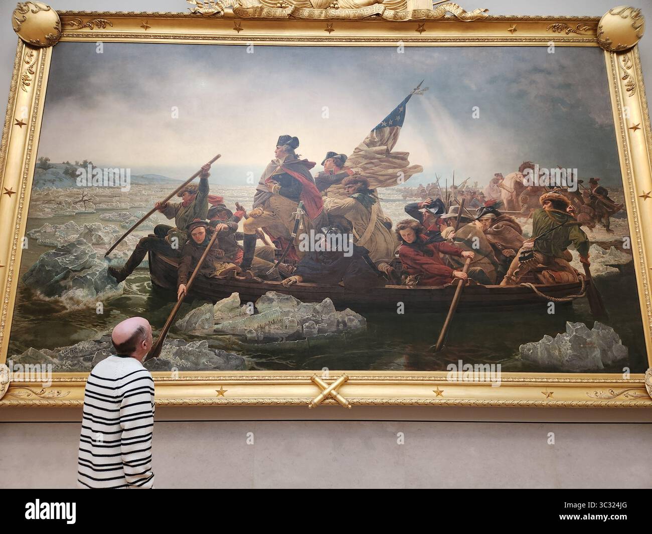 Uomo che guarda Washington Crossing il dipinto del Delaware al Metropolitan Museum of Art Foto Stock