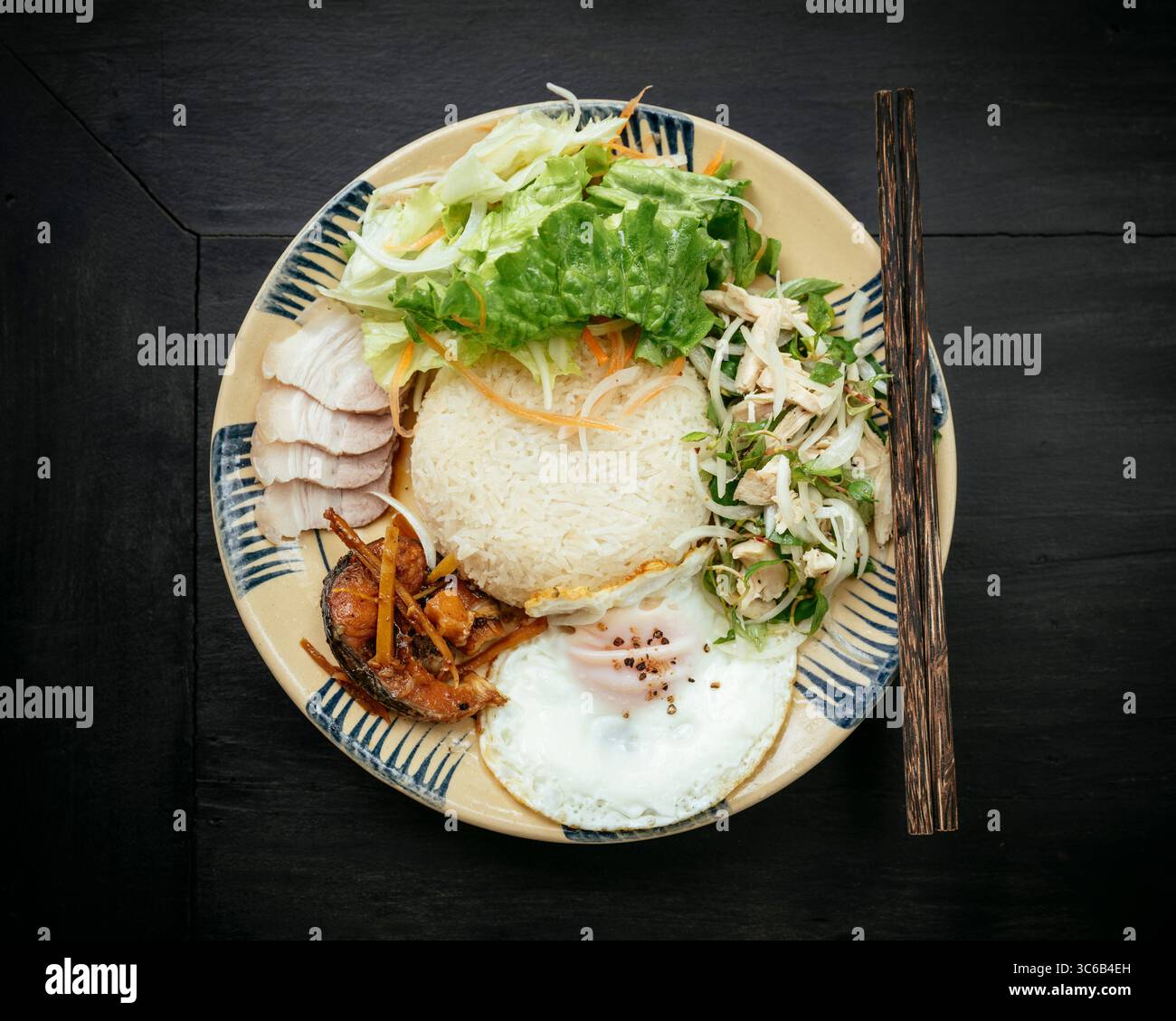 Piatto di riso Nha Den, Hoi An, provincia di Quảng Nam, Vietnam Foto Stock