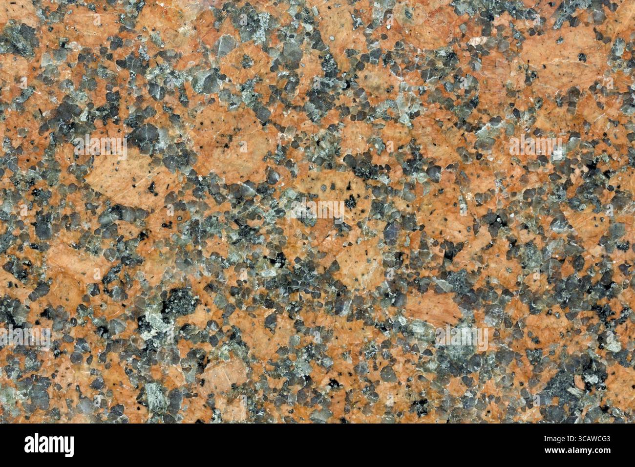 Immagine di sfondo ad alta risoluzione con trama in pietra di granito arancio raro lucidato Foto Stock