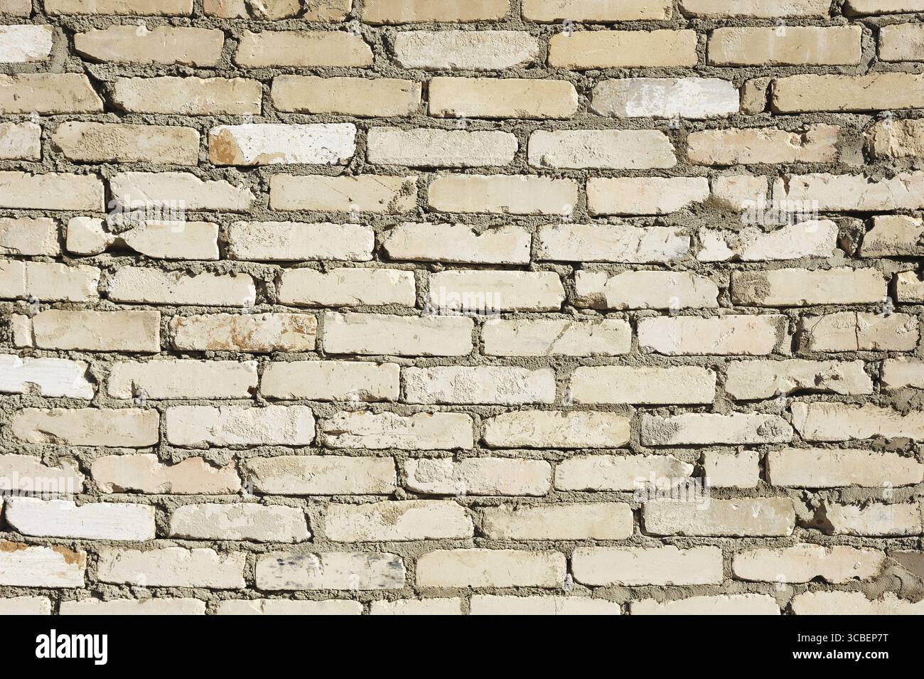 Texture - una parete di mattoni grigi rettangolari ruvidi Foto Stock